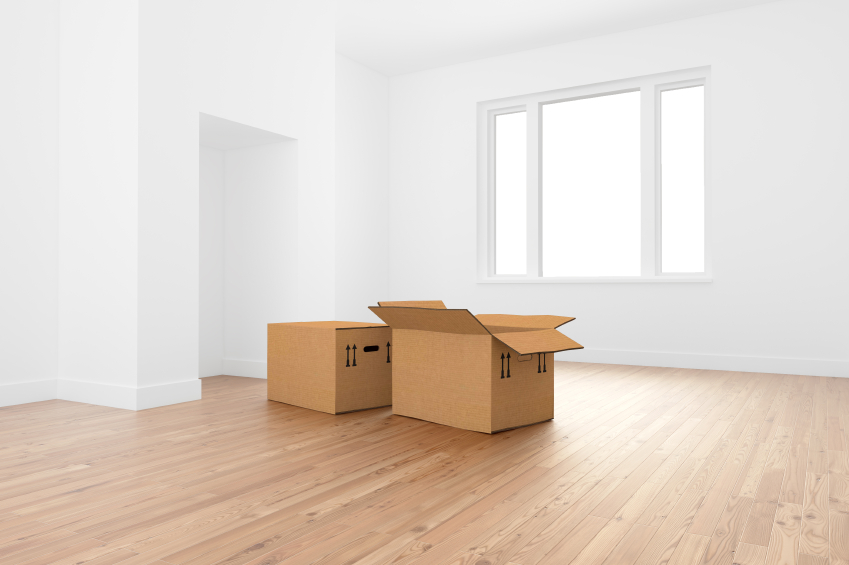 Empty room with two cardboard boxes inside