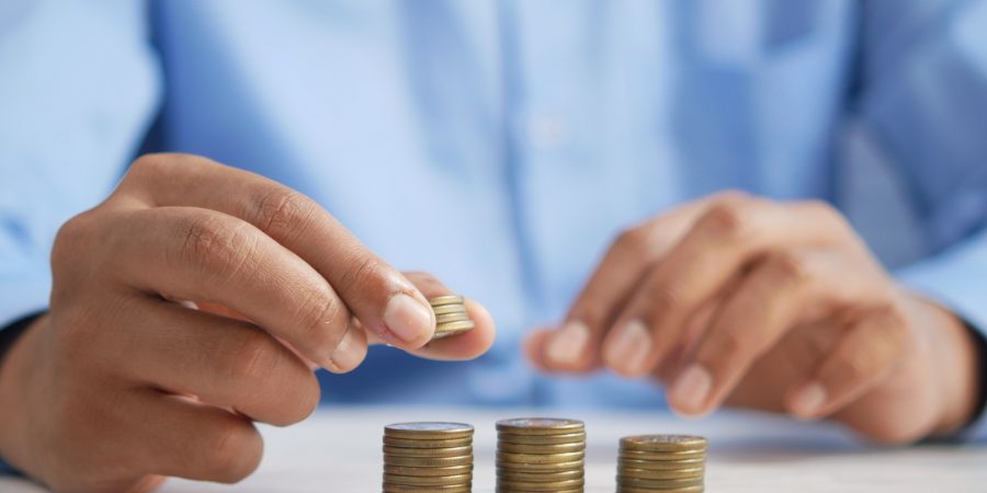 Close-up shot on man's hands rolling coins